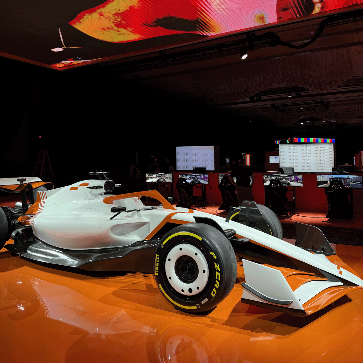 F1 show car on an orange event display